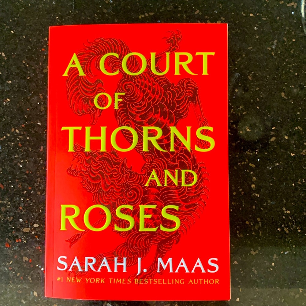 Paperback “ A Court of Thorns and Roses” by Sarah J.Maas